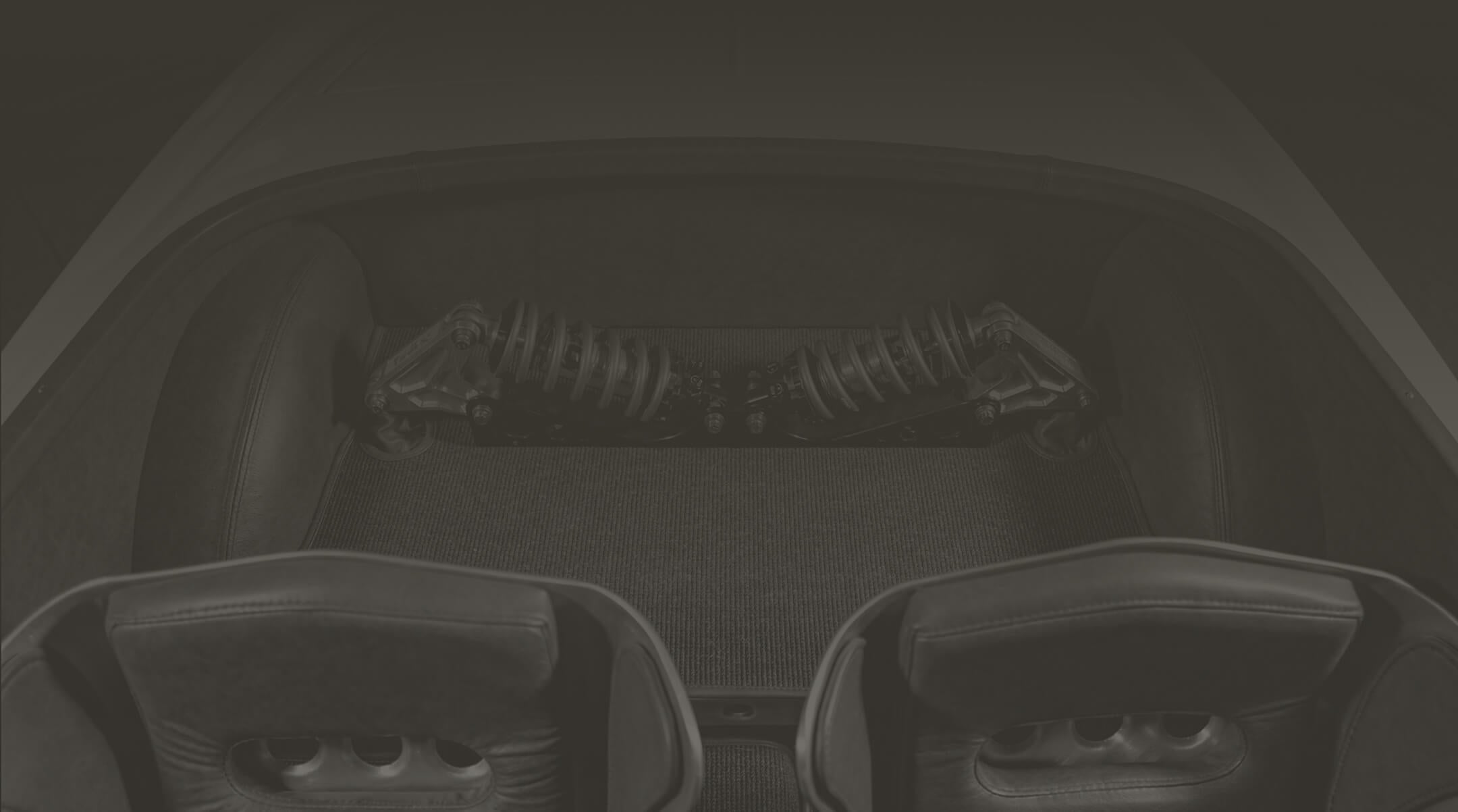 Interior view of a car showing the suspension system.