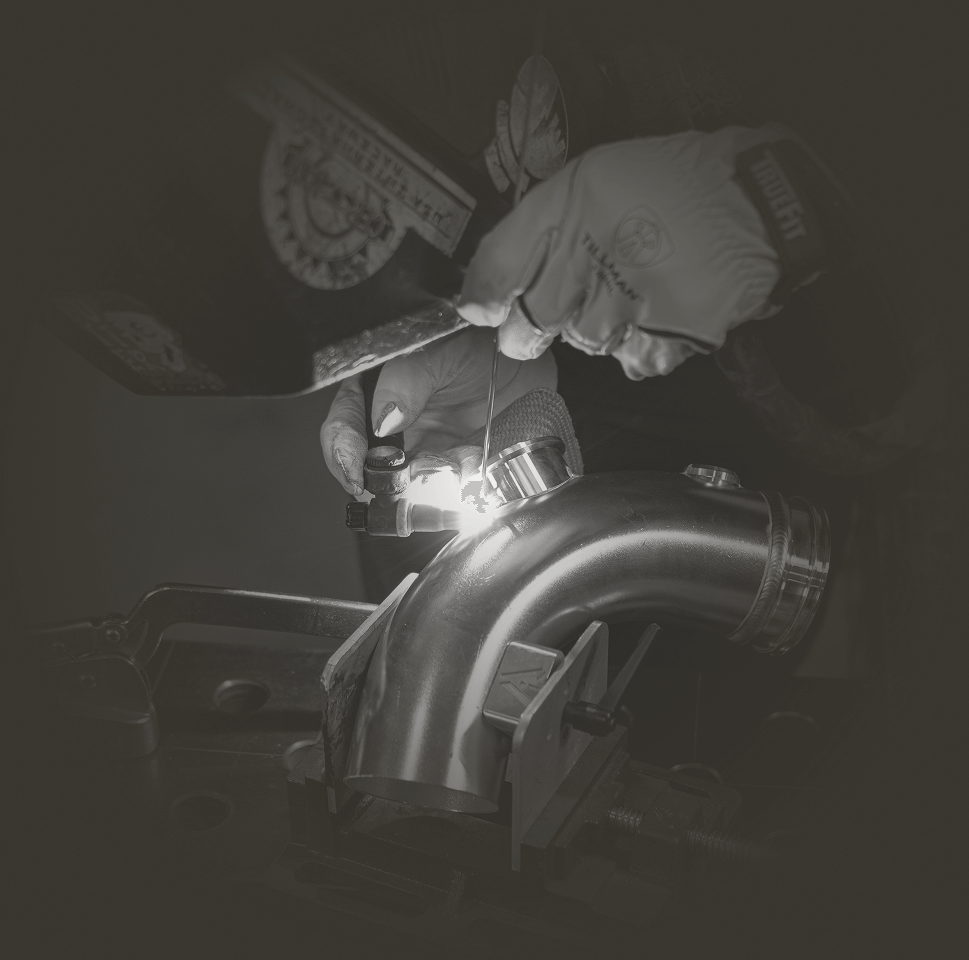 Close-up of a welding process on a metal pipe.